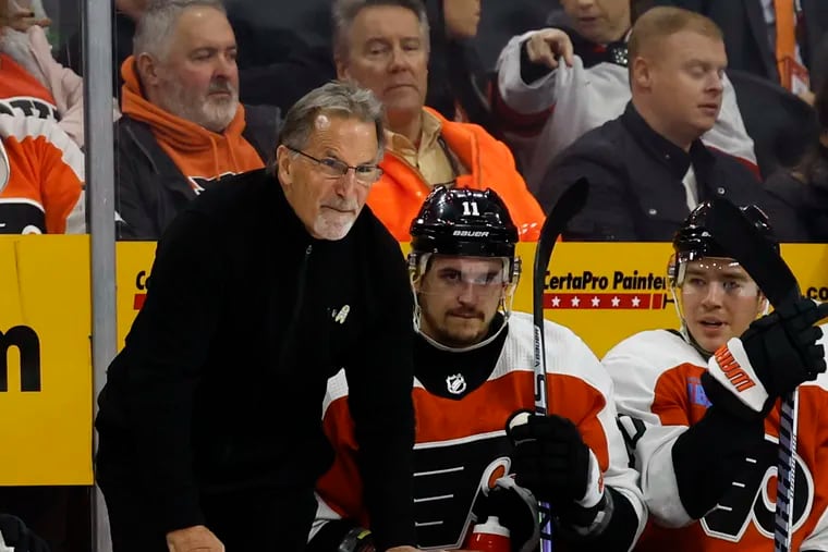 Flyers head coach John Tortorella yells toward the ice during a game earlier this season.