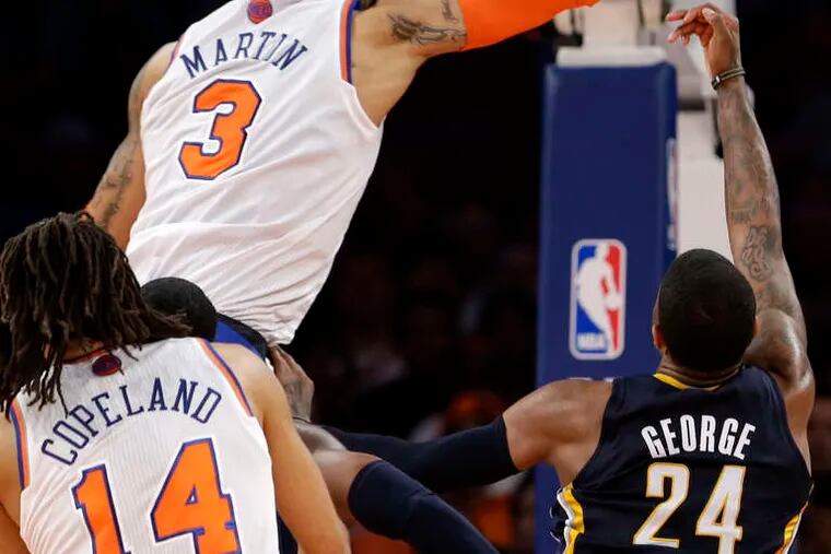 The Knicks' Kenyon Martin blocks a shot by Indiana's Paul George in the second half of Game 5 at the Garden.