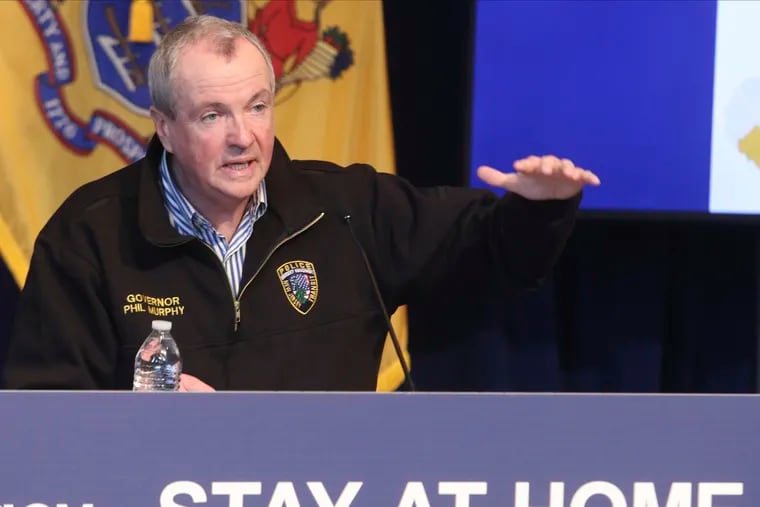 New Jersey Gov. Phil Murphy holds a news conference regarding the COVID-19 cases at the War Memorial in Trenton, N.J., on Saturday.