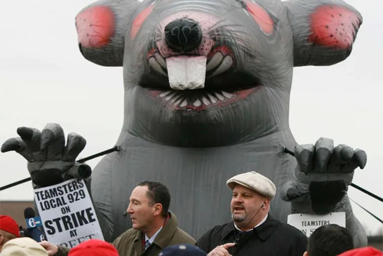 Giant inflatable rats are fixtures of local union protests like this one by Teamsters in 2010. Conservative Republicans in Pa. say that a 'paycheck protection' proposal is not an attempt to bust unions or reduce union money and/or clout.