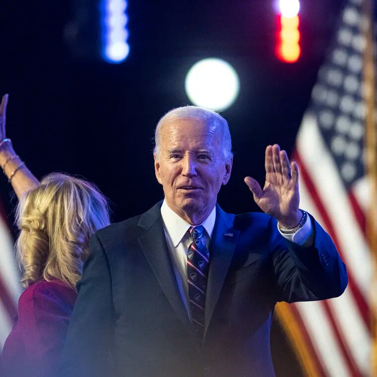 President Joe Biden and first lady Jill Biden wave during an appearance at Montgomery County Community College in Blue Bell on Jan. 5, 2024.