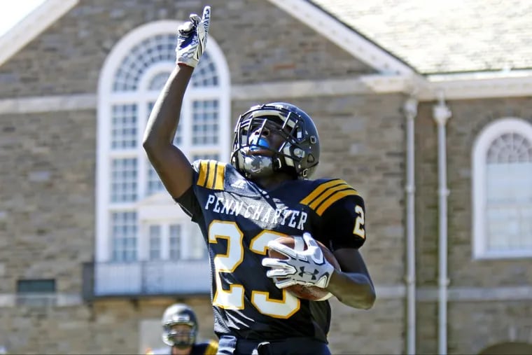 Penn Charter’s John Washington points upward after he scores on a 53-yard punt return against Interboro in the second quarter of a nonleague football game on Saturday.