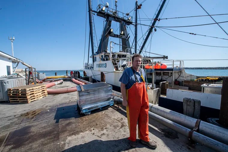 Fishing boat captain Hank Lackner stands near his boat at Lunds Fishery in Cape May.