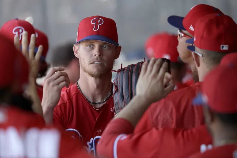Pitcher Clay Buchholz in the Phillies' dugout with his teammates against the New York Yankees in a spring training game on Friday, March 10, 2017.