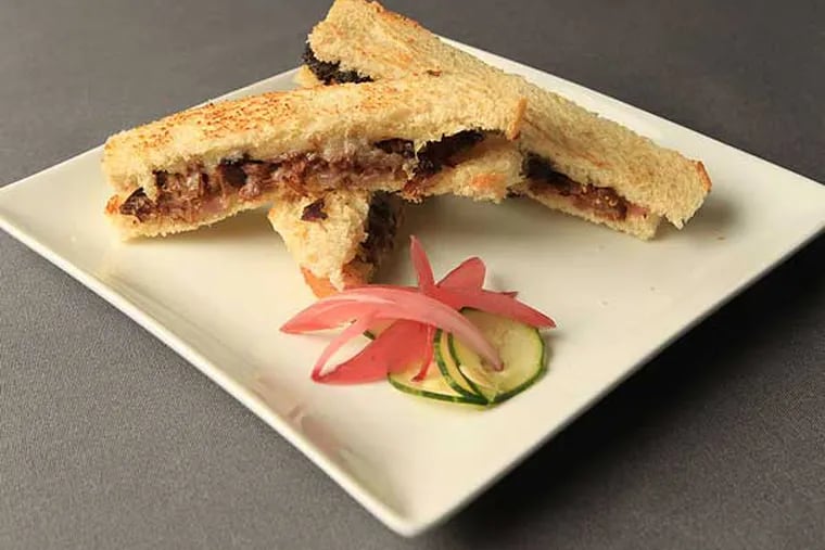 A highlight at Caleb’s American Kitchen: Grilled cheese updated with shreds of tender braised short rib.