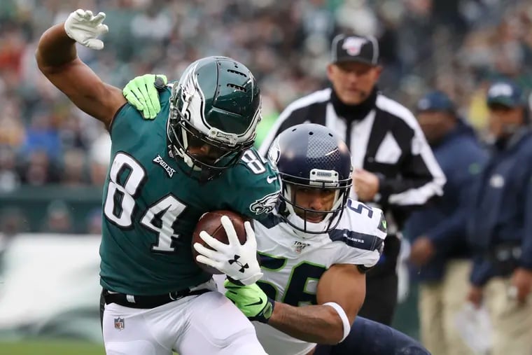 Eagles wide receiver Greg Ward picks up a first down with Seattle Seahawks linebacker Mychal Kendricks pulling him down during the first quarter on Sunday, November 24, 2019 at Lincoln Financial Field in Philadelphia.