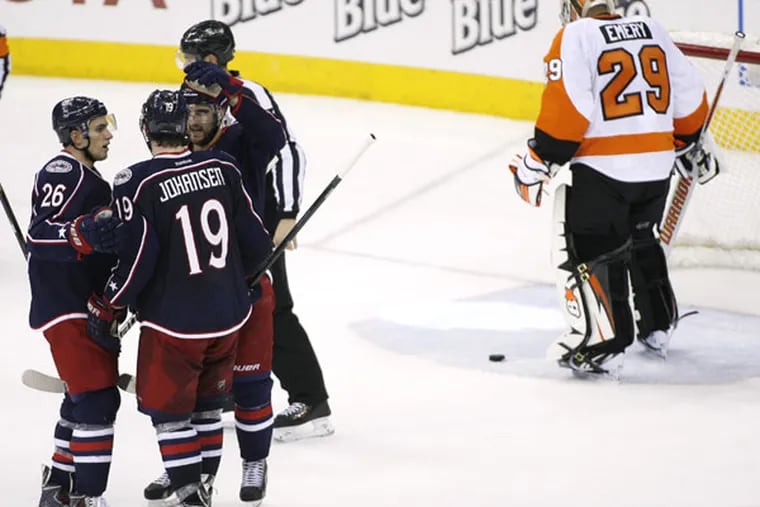 The Blue Jackets' Ryan Johansen (19) is congratulated by teammates after scoring on Philadelphia Flyers goalie Ray Emery (29) during the third period of an NHL hockey game on Saturday, Dec. 21, 2013, in Columbus, Ohio. Columbus won 6-3. (Mike Munden/AP)