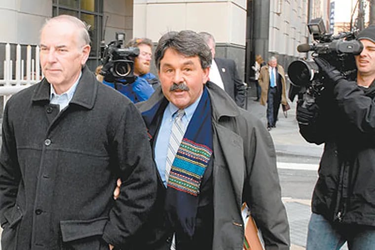 Rev. Charles Englehardt (left) leaves the criminal justice center with his attorney, Michael McGovern following a hearing Friday where he was held over for trial. He is accused of raping an altar boy (Tom Gralish / Staff Photographer)
