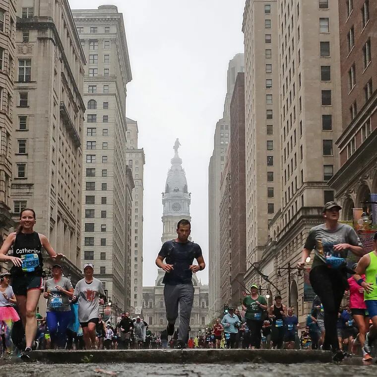 Runners pass Walnut Street during the 43rd annual Independence Blue Cross Broad Street Run in April 2023.