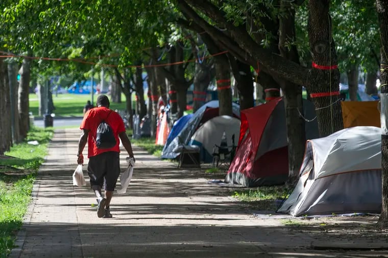 The encampment on the Benjamin Franklin Parkway on Aug. 20. While some say closing encampments is just necessary to protecting public space and preserving order, critics describe it as “squeezing a balloon” — moving people from one location to another, without addressing underlying causes.