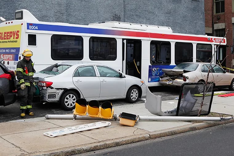 The scene of a SEPTA bus crash on 11th Street near Vine Street on Friday, April 4, 2014. ( MICHAEL S. WIRTZ / Staff Photographer )