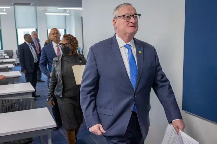 Philadelphia Mayor Jim Kenney arrives at a Tuesday news conference to discuss the details in the shooting death of Temple University police officer Christopher Fitzgerald.
