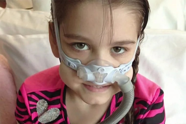 Sarah Murnaghan wears a mask at the Children's Hospital of Philadelphia. Her case led to an appeal and review system for prioritizing organ transplant lists. (family photo)