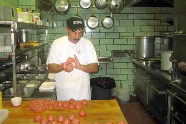 Basil DeLuca at work on his specialty, meatballs of consistent character. He fries them, 16 at a time, for a browned crust, tender interior; then, into the gravy. Villa di Roma, in the Italian Market since 1963, is opening a new production kitchen a couple of doors down.