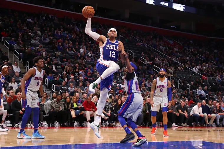 Sixers' forward Tobias Harris (12) drives to the basket past Tim Frazier for two of his season-high 35 points.