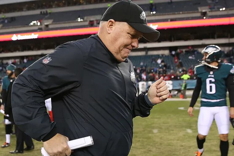 Eagles head coach Chip Kelly jogs off the field after a loss.