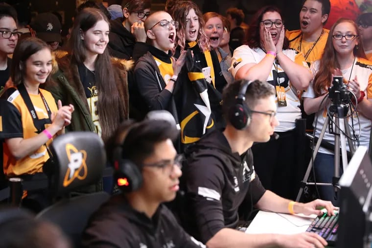 Fans cheer on the Philadelphia Fusion at its Homecoming showmatch. The fusion, Comcast's competitive gamers, played its first physical game in Philadelphia. Matches are normally based in Los Angeles.