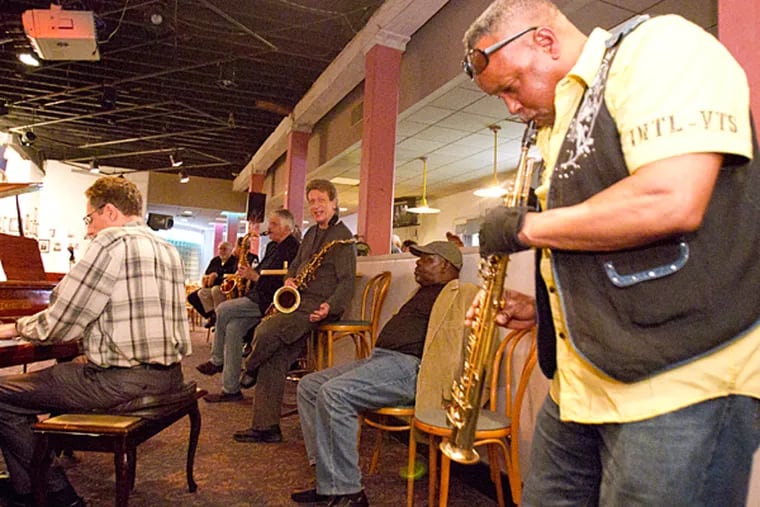 Saxophonist Glenn Williams solos at the jam session on June 2, 2015.  ( CHARLES FOX / Staff Photographer )