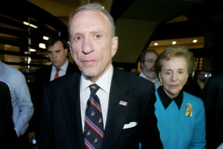 U.S. Sen. Arlen Specter, left, and his wife Joan, right, leave election night headquarters after conceding the Democratic primary election to John Sestak. ( Charles Fox / Staff Photographer )