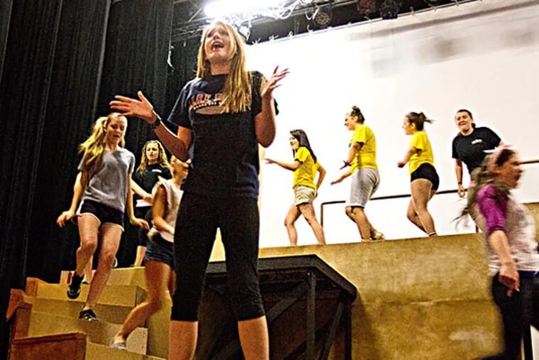 Amanda Peacock, 14, of Williamstown (foreground) will understudy the lead roll of Elle Woods.  Here she rehearses the song ‘So Much Better’ from Legally Blonde during Summer Theater Camp at the Grand Theater, Williamstown, July 23, 2013.  ( DAVID M WARREN / Staff Photographer )