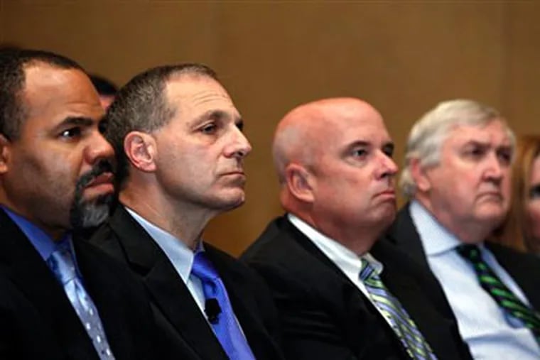 Former FBI director Louis Freeh, second from left, listens during a press availability to announce he will lead an independent investigation into allegations of child abuse by a former Penn State employee Monday, Nov. 21, 2011 in Philadelphia. (AP Photo/Alex Brandon)