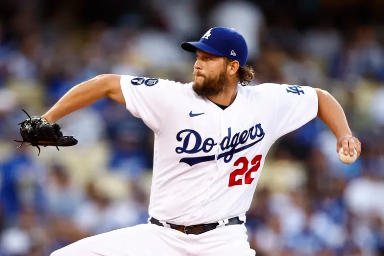 Clayton Kershaw returns for his 16th season with the Los Angeles Dodgers, who are projected for 96.5 victories this year after winning a franchise-record 111 games in 2022. (Photo by Ronald Martinez/Getty Images)