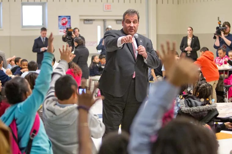 Gov. Chris Christie takes questions from students in the cafeteria during a visit to the Dudley Family School, Camden, January 23, 2014.  ( DAVID M WARREN / Staff Photographer )