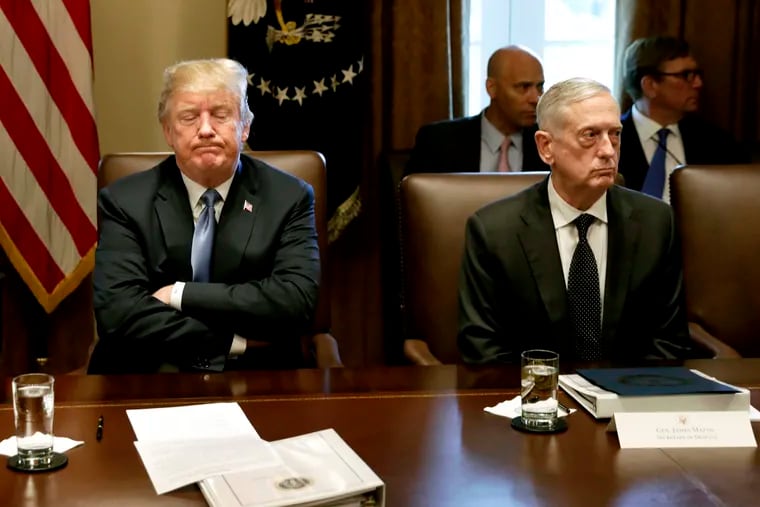 President Donald Trump, left, pauses while speaking as James Mattis, secretary of defense, listens during a Cabinet meeting at the White House in Washington on June 21, 2018.