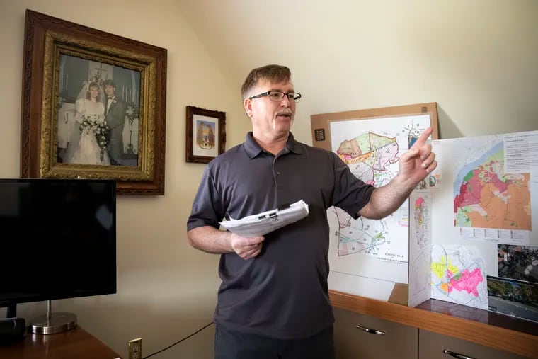Longtime local resident Keith Walton, a retired carpenter, has created displays using zoning maps and other data to make a case against further warehouse development in Oldmans Township in Salem County, N.J.