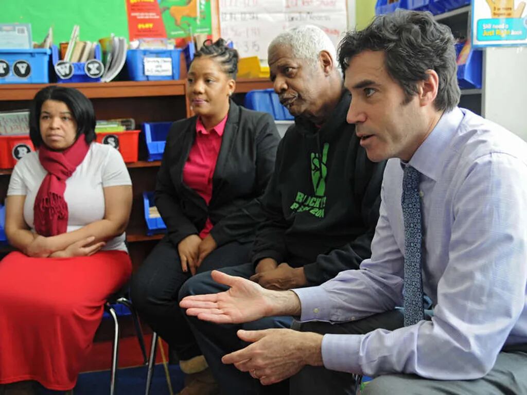 Mastery Charter Schools founder and CEO Scott Gordon is leaving the network he founded at the end of the 2022-23 school year. Gordon (right) is shown in this 2015 file photo at a meeting with parents (from left) Sheree Monroe, Zakiya Cherif and Tyrone Sims at the Hardy Williams Academy Mastery Charter School.