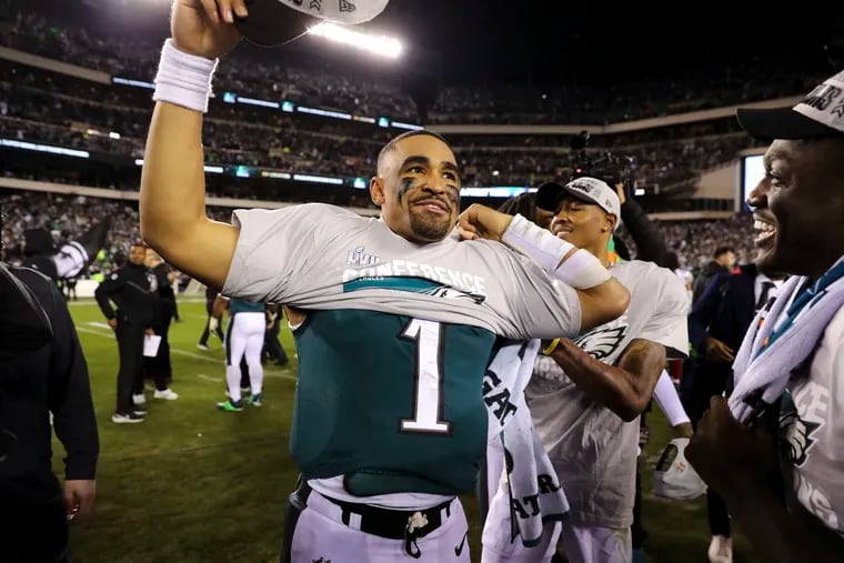 Jalen Hurts celebrates after winning the NFC championship game, one of several highlights in Philadelphia's past calendar year. Three teams are resetting as the Phillies surge: Where will they be in a year?