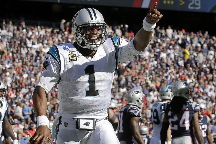 Carolina Panthers quarterback Cam Newton celebrates his rushing touchdown against the New England Patriots during the second half of an NFL football game, Sunday, Oct. 1, 2017, in Foxborough, Mass.