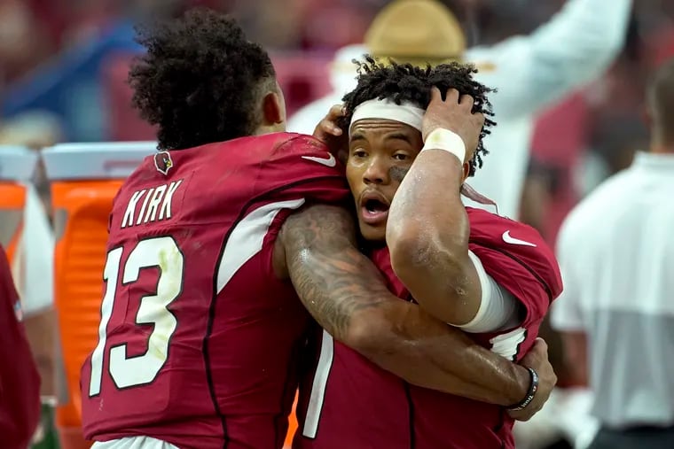 Arizona Cardinals quarterback Kyler Murray (right) reacts with wide receiver Christian Kirk during the final seconds of Sunday's tie with Detroit.