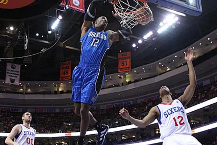 Dwight Howard dunks for 2 of his 19 points during the Sixers' 95-85 loss to the Magic. (Ron Cortes/Staff Photographer)