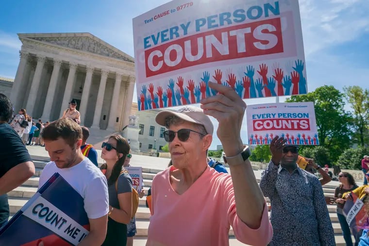 FILE - In this April 23, 2019, file photo, immigration activists rally outside the Supreme Court as the justices hear arguments over the Trump administration's plan to ask about citizenship on the 2020 census, in Washington.