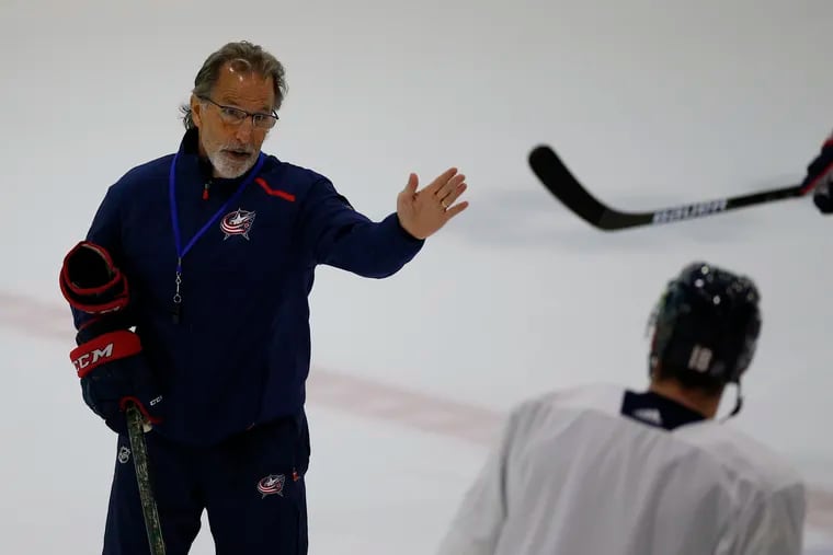 Columbus Blue Jackets coach John Tortorella talking with players during practice in July 2020.