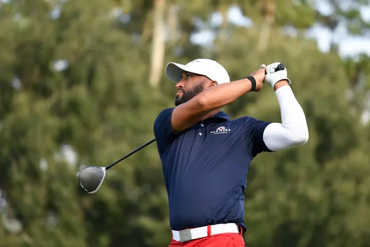 Willie Mack III let's a drive rip, sporting the Farmers Insurance logo on his shirt. Farmers sponsors than annual PGA Tour event at Torrey Pines.