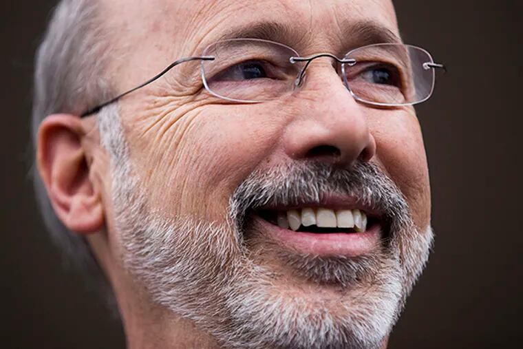 In this Nov. 5, 2014 file photo, Pennsylvania Democratic Gov.-elect Tom Wolf speaks with members of the media outside the Manchester Cafe the day after he won the gubernatorial election in Manchester, Pa. (AP Photo/Matt Rourke, File)