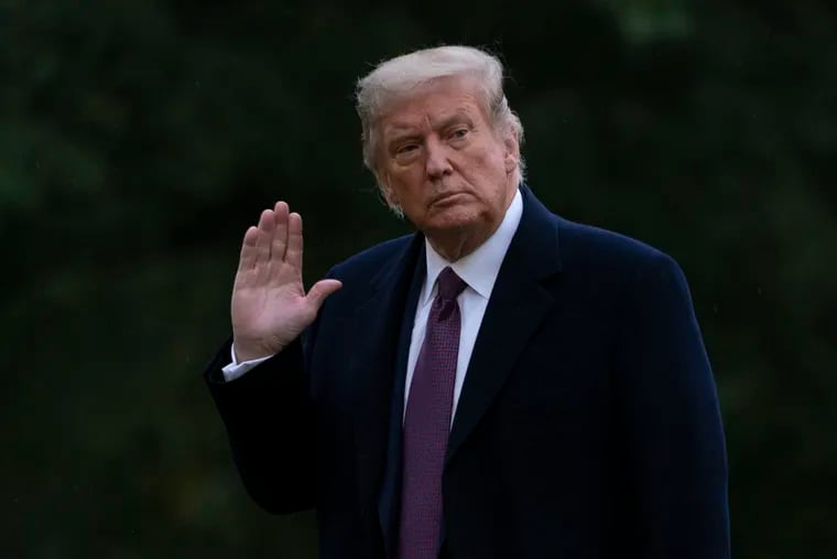 President Donald Trump waves as he walks from Marine One to the White House in Washington, Thursday, Oct. 1, 2020, as he returns from Bedminster, N.J. Trump and first lady Melania Trump have tested positive for the coronavirus, the president tweeted early Friday. (AP Photo/Carolyn Kaster)