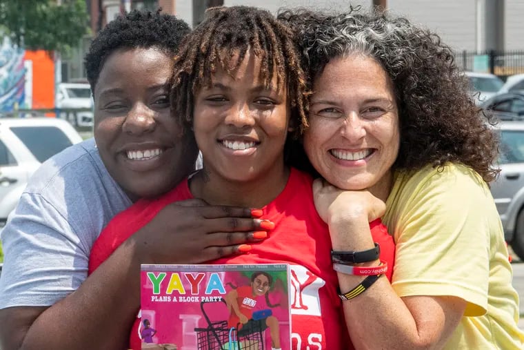 Ayanna "Yaya" Bridges (center) with Briana Clarke (left) and Rebecca Fabiano. Bridges stars in a new children's book about the city's Play Captains written by Fabiano and illustrated by Clarke.