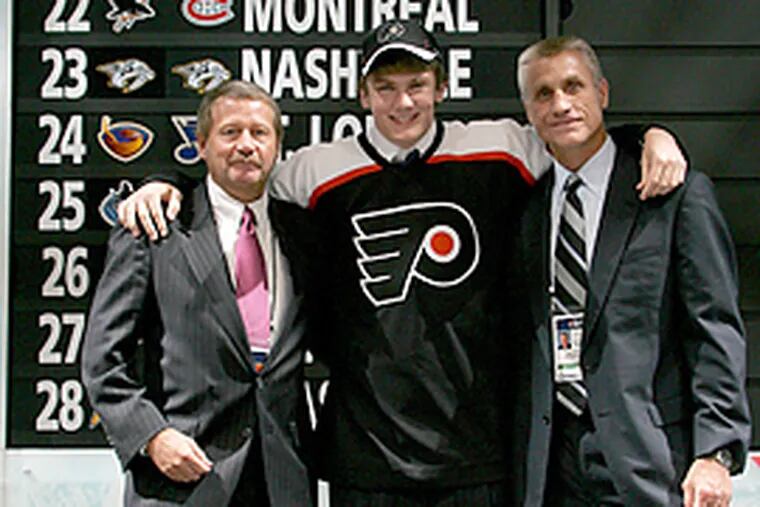Flyers GM Paul Holmgren (right) chose James vanRiemsdyk (center) with his top pick at last year's draft.