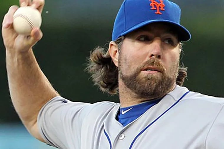 Mets' R.A. Dickey won his 20th game Thursday night. (AP file photo)