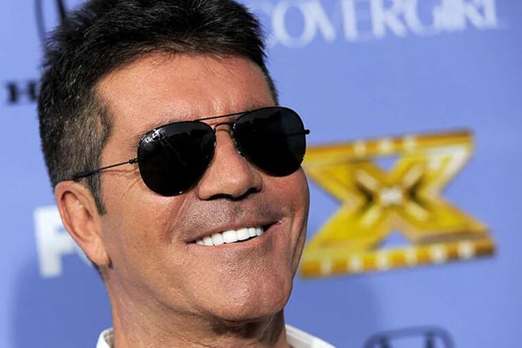 Simon Cowell: Us Weekly says he has bought the rock and is set to propose.