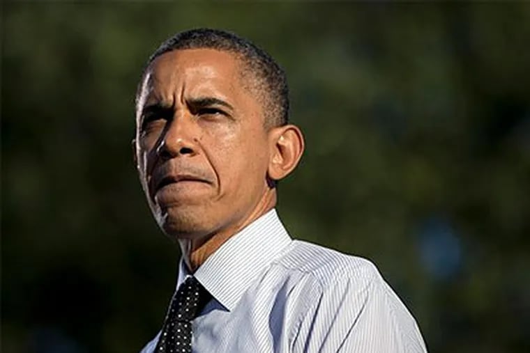 President Barack Obama pauses as he speaks at a campaign event at The Ohio State University Oval, Tuesday, Oct. 9, 2012, in Columbus, Ohio. (AP Photo / Carolyn Kaster)