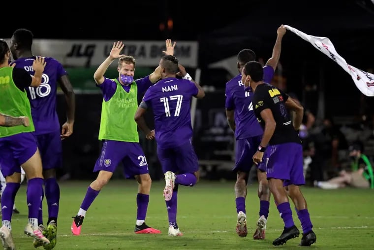 Orlando City players celebrating after the win.