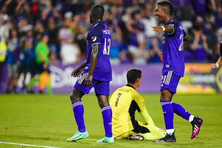 Orlando City forward Benji Michel (left) celebrates with midfielder Andres Perea (right) after scoring his team's opening goal against the Union.