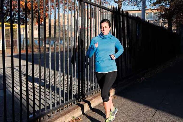 Avid runner and Army veteran, Nichole Duchman, goes for her daily run on Wednesday aftnernoon, November 13, 2013. Duchman runs about 5 miles every day, and will be participating in the Philadelphia Marathon this weekend. ( KELSEY ANNE DUBINSKY / staff photographer )