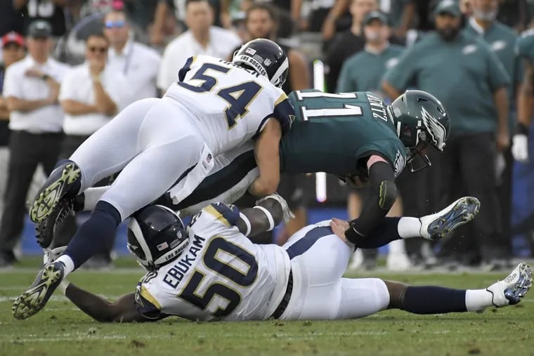 Philadelphia Eagles quarterback Carson Wentz suffered a knee injury during the third quarter of Sunday’s 43-35 win over the Los Angeles Rams that took him out of the game.