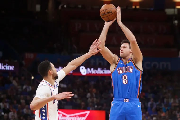 Thunder forward Danilo Gallinari shoots over Sixers guard Ben Simmons during the first half Friday night in Oklahoma City. The Sixers lost, 127-119, in overtime.
