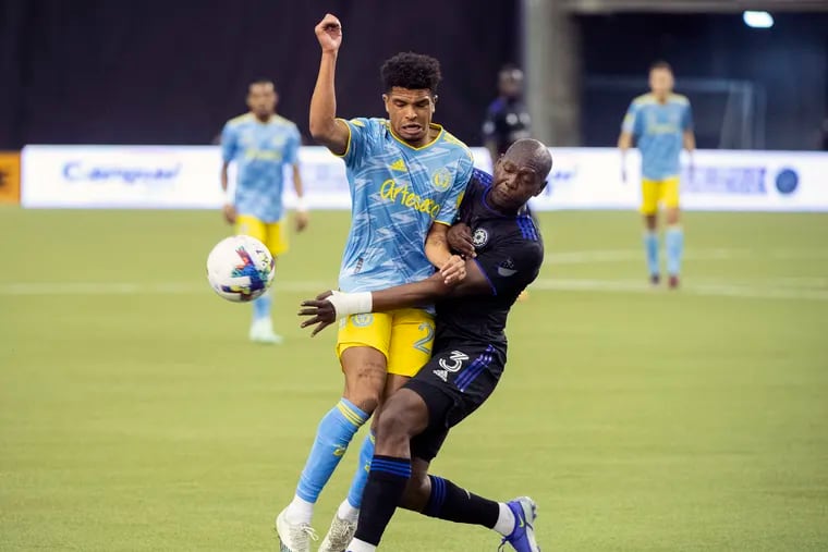 The Union's Nathan Harriel (left) tangles with Montreal's Kamal Miller during the first half.